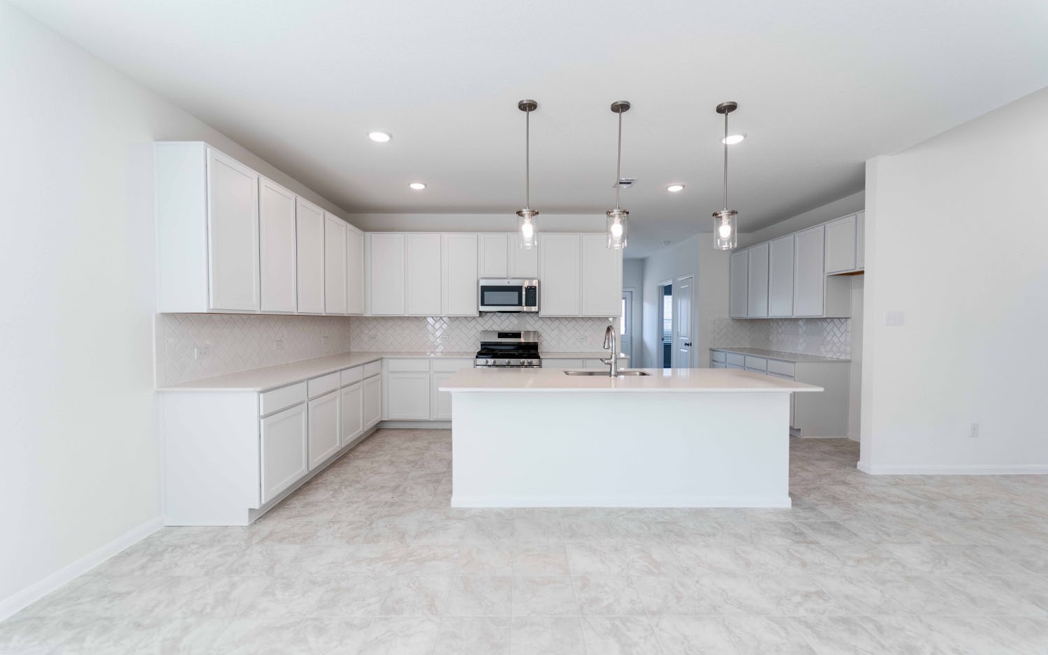 428 Monarch Trail Huntsville, TX 77340 - Photo 6 of 16 a kitchen with kitchen island a sink stainless steel appliances and cabinets