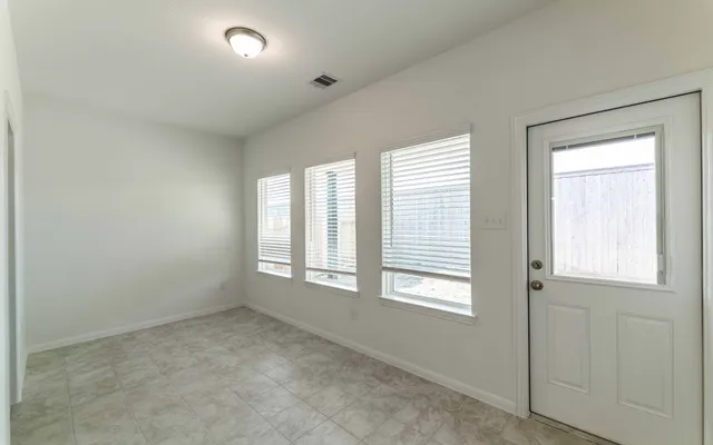 an empty room with windows