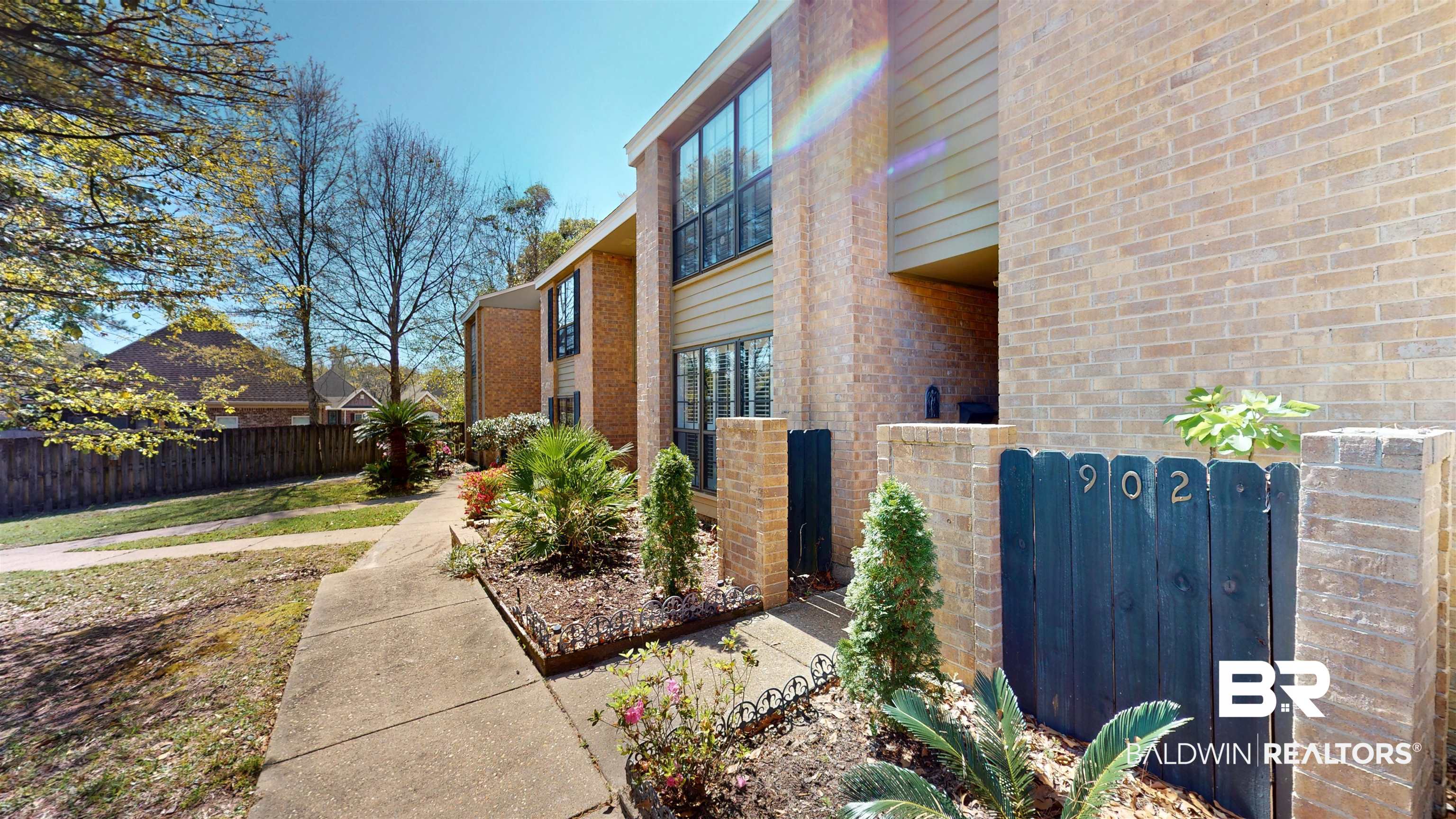 2901 Grant Street, Unit 902 Mobile, AL 36606 - Photo 21 of 35 View of home's exterior featuring brick siding