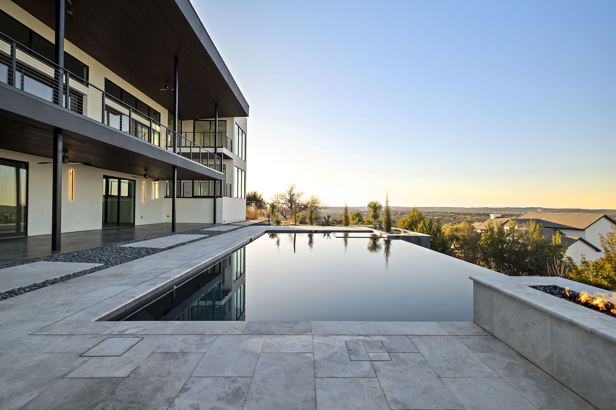 1702 Moonlight Trace Spicewood, TX 78669 - Photo 39 of 40 View of swimming pool with an infinity pool, patio surround, and a fire pit