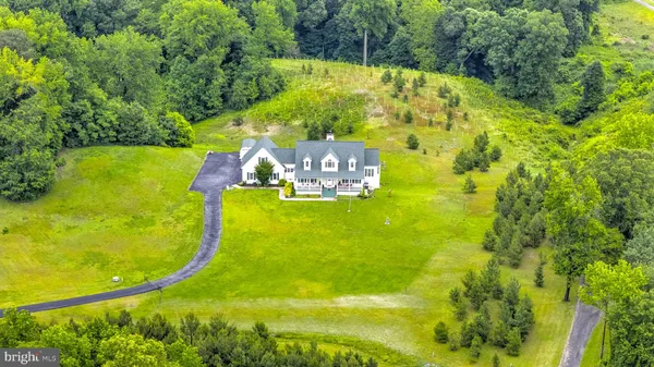 a view of a swimming pool with a yard