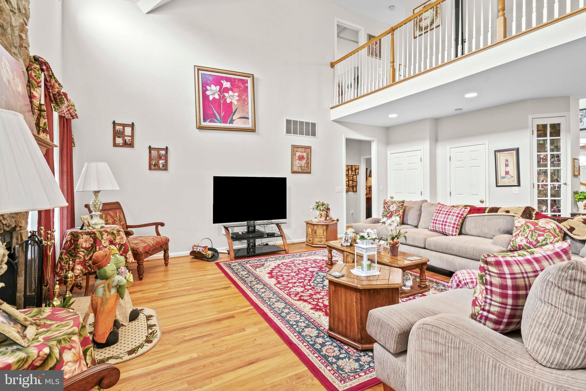 94 Friendship Road Friendship, MD 20758 - Photo 14 of 40 a living room with furniture and a flat screen tv