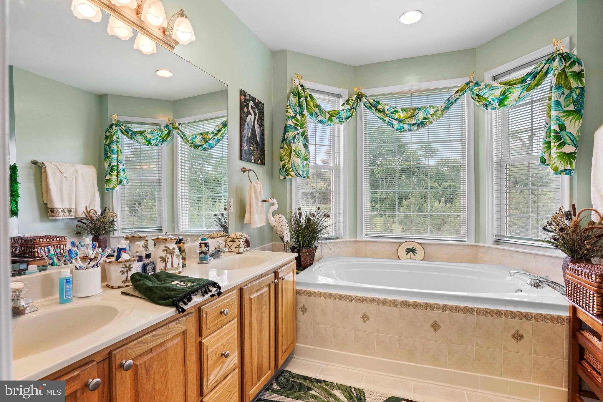 94 Friendship Road Friendship, MD 20758 - Photo 18 of 40 a bathroom with a tub sink and mirror