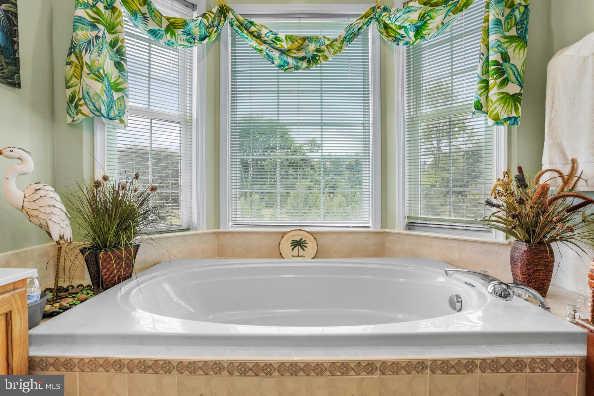 94 Friendship Road Friendship, MD 20758 - Photo 19 of 40 a bathroom with a tub and sink