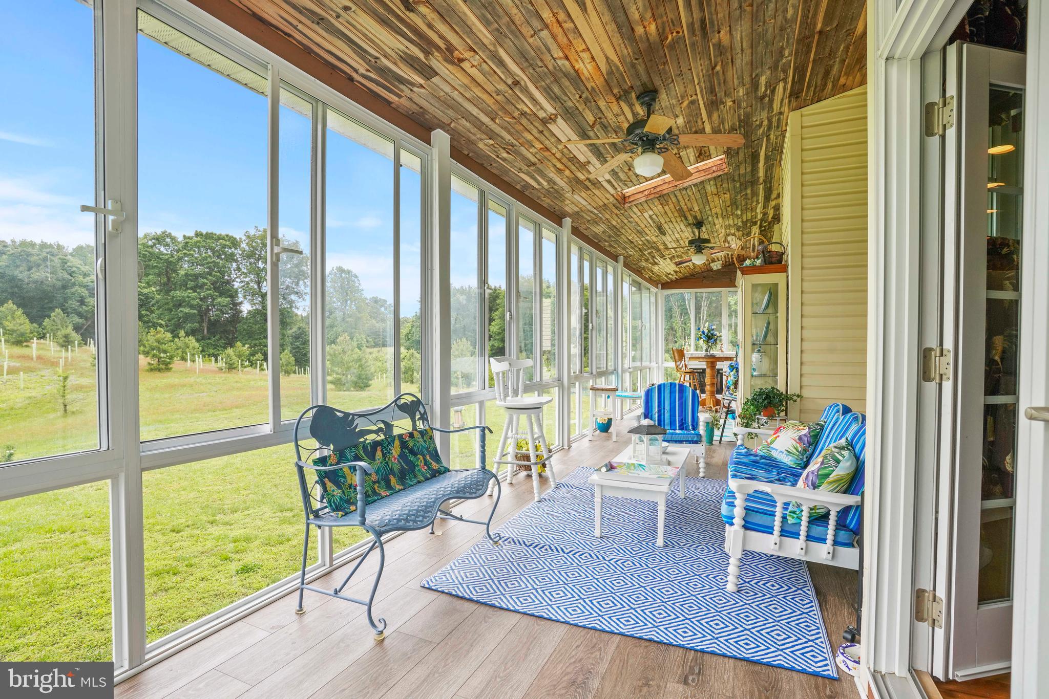 94 Friendship Road Friendship, MD 20758 - Photo 22 of 40 a living room filled with furniture and a large window