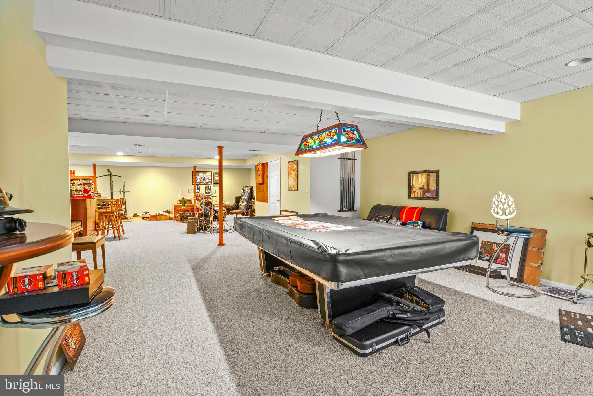 94 Friendship Road Friendship, MD 20758 - Photo 27 of 40 a living room with a flat screen tv and a table
