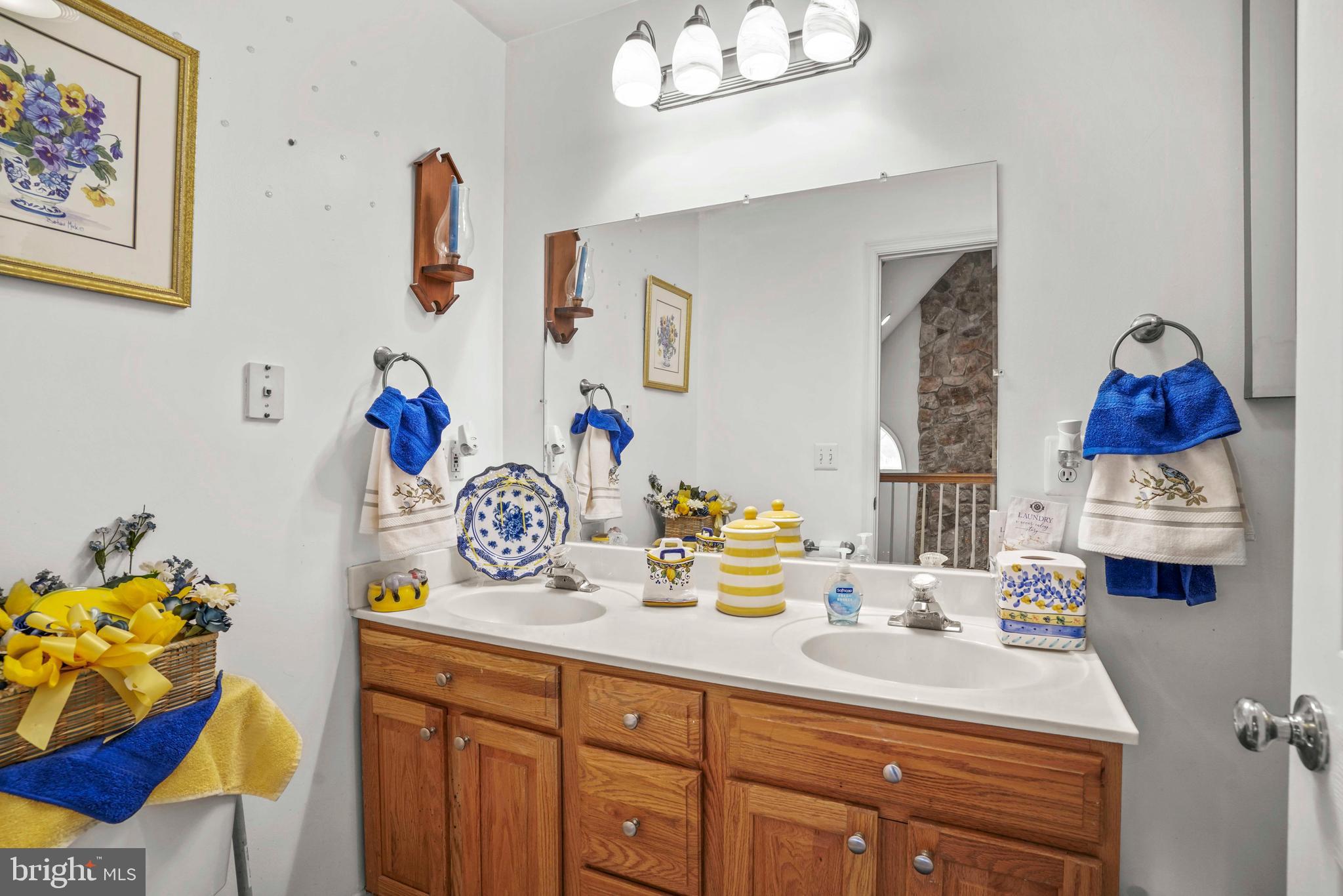 94 Friendship Road Friendship, MD 20758 - Photo 34 of 40 a bathroom with a sink mirror and vanity