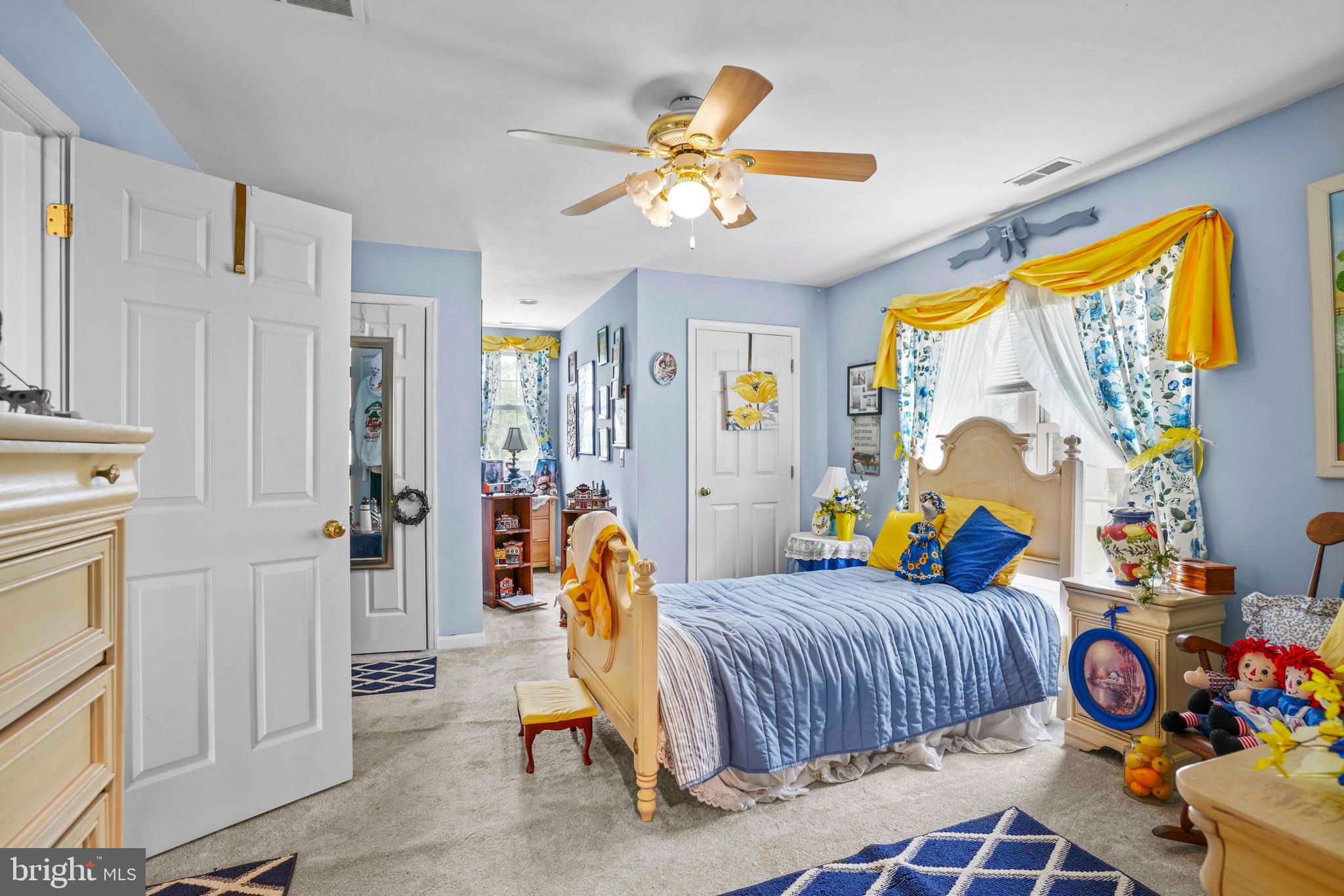 94 Friendship Road Friendship, MD 20758 - Photo 35 of 40 a bedroom with a bed and a chandelier