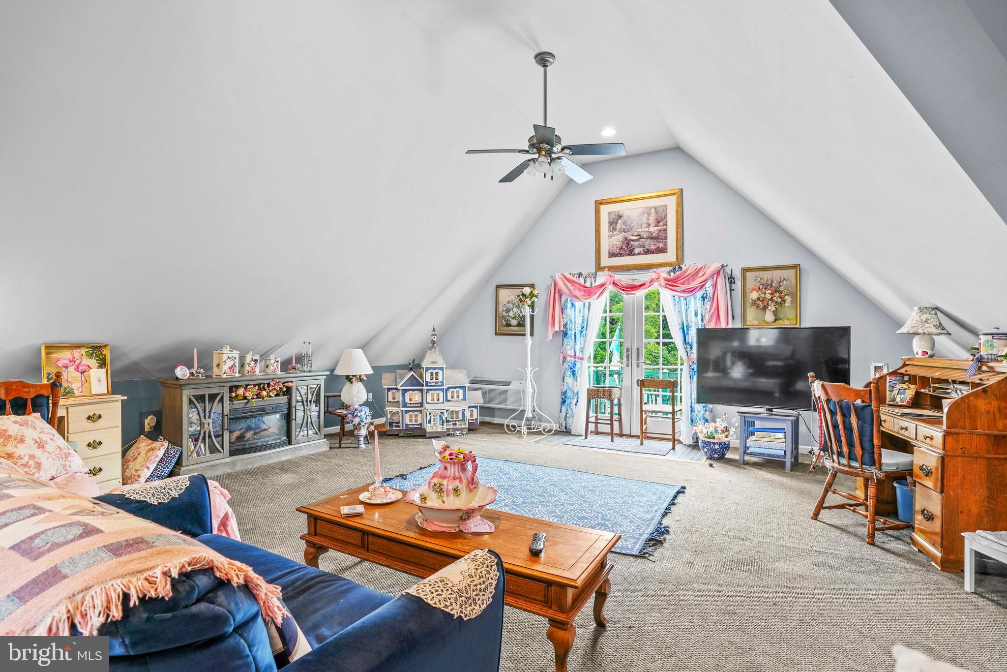 94 Friendship Road Friendship, MD 20758 - Photo 38 of 40 a living room with furniture a flat screen tv and a large window