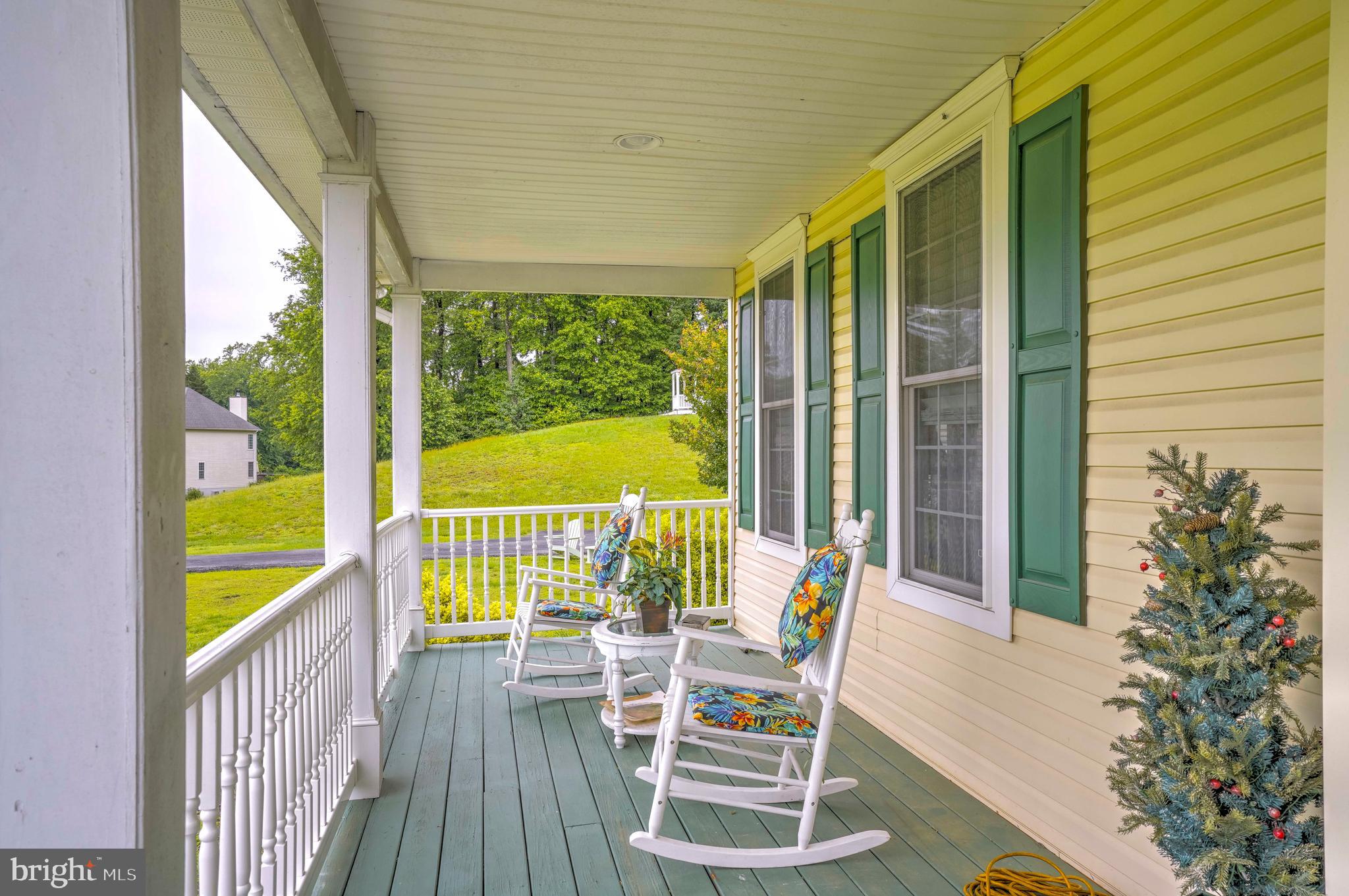 94 Friendship Road Friendship, MD 20758 - Photo 40 of 40 a view of a chair and tables in the balcony