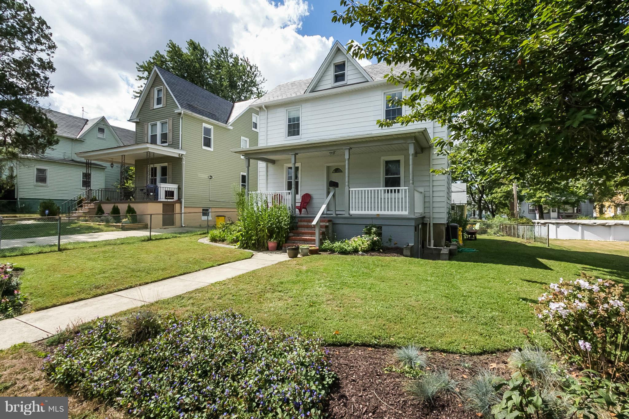 5506 Tramore Road Baltimore, MD 21214 - Photo 1 of 30 a front view of a house with a yard and trees