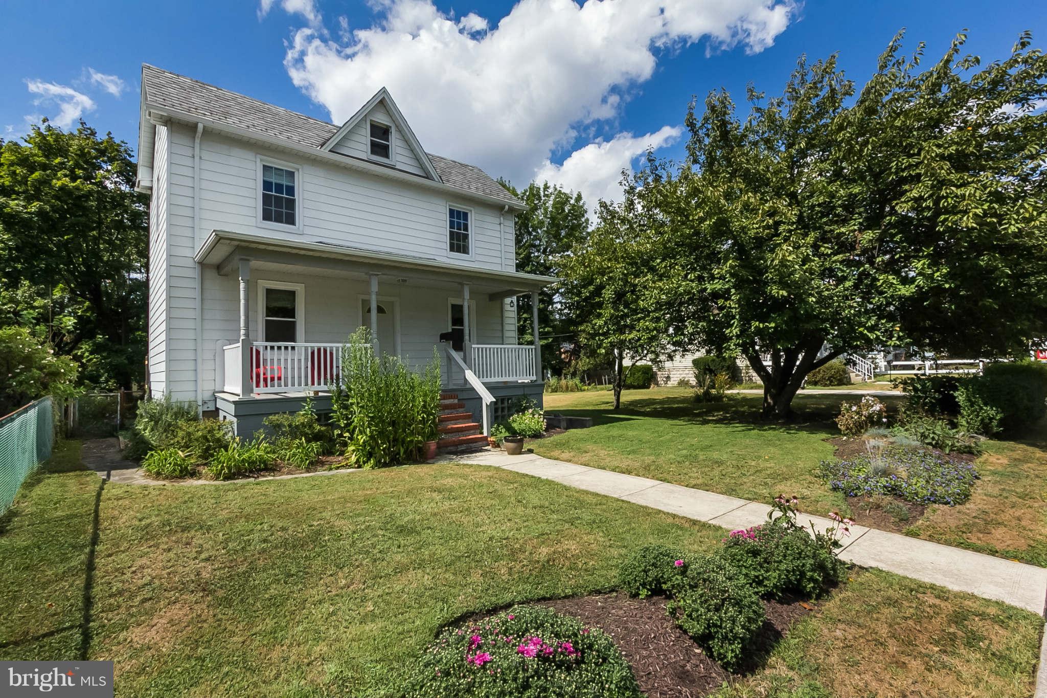 5506 Tramore Road Baltimore, MD 21214 - Photo 2 of 30 a front view of a house with garden