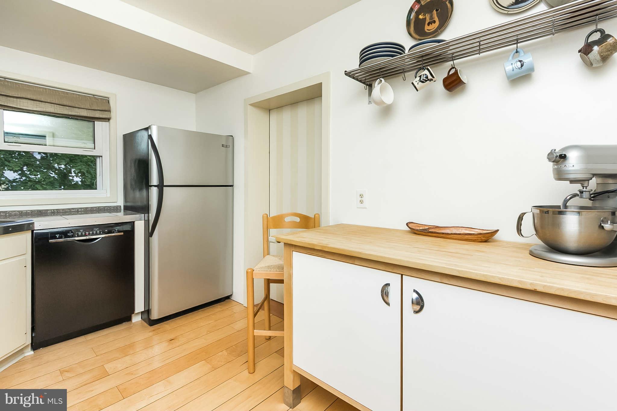 5506 Tramore Road Baltimore, MD 21214 - Photo 14 of 30 a kitchen with a refrigerator and a sink