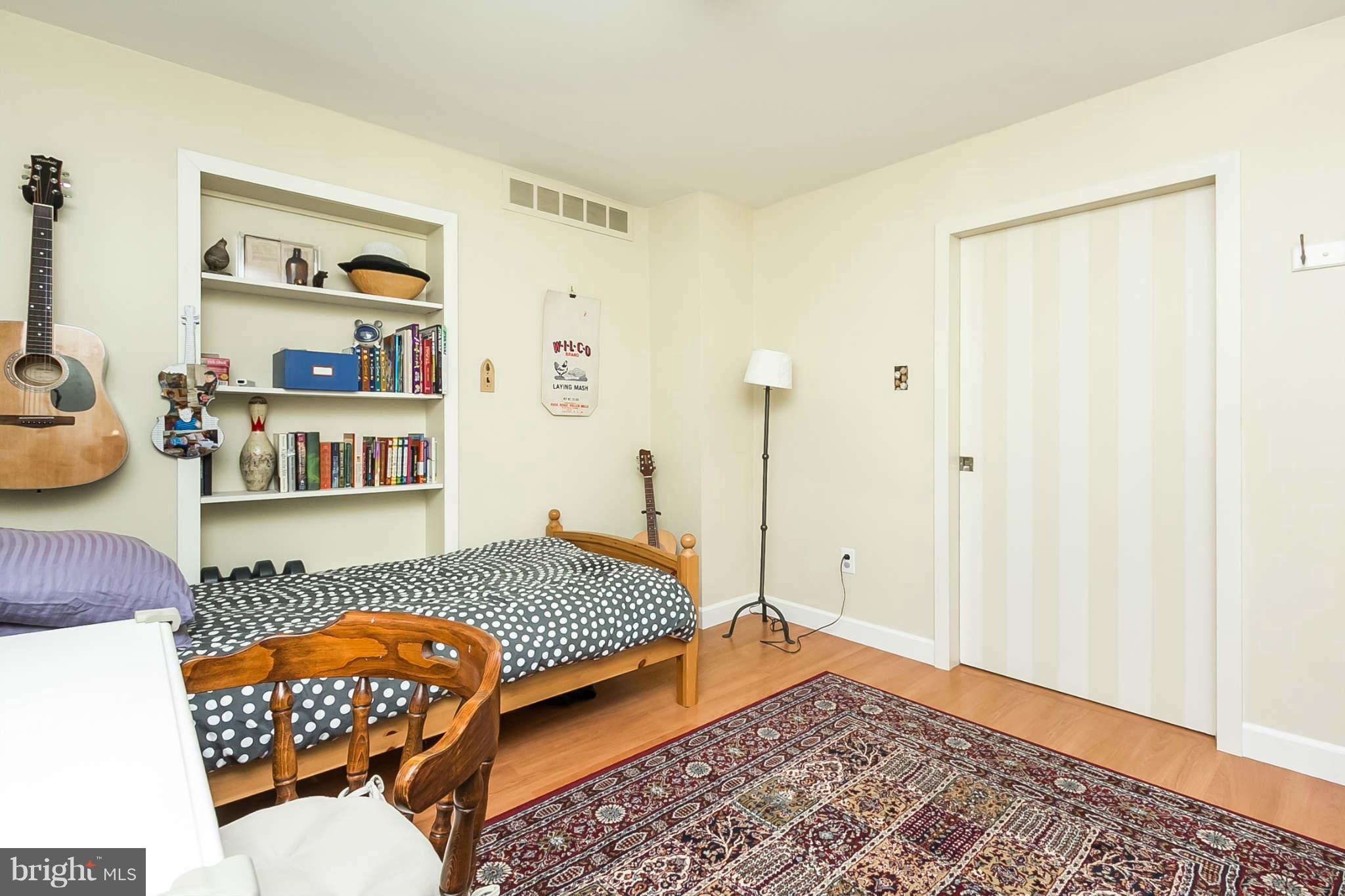 5506 Tramore Road Baltimore, MD 21214 - Photo 17 of 30 a bedroom with furniture and a wooden floor