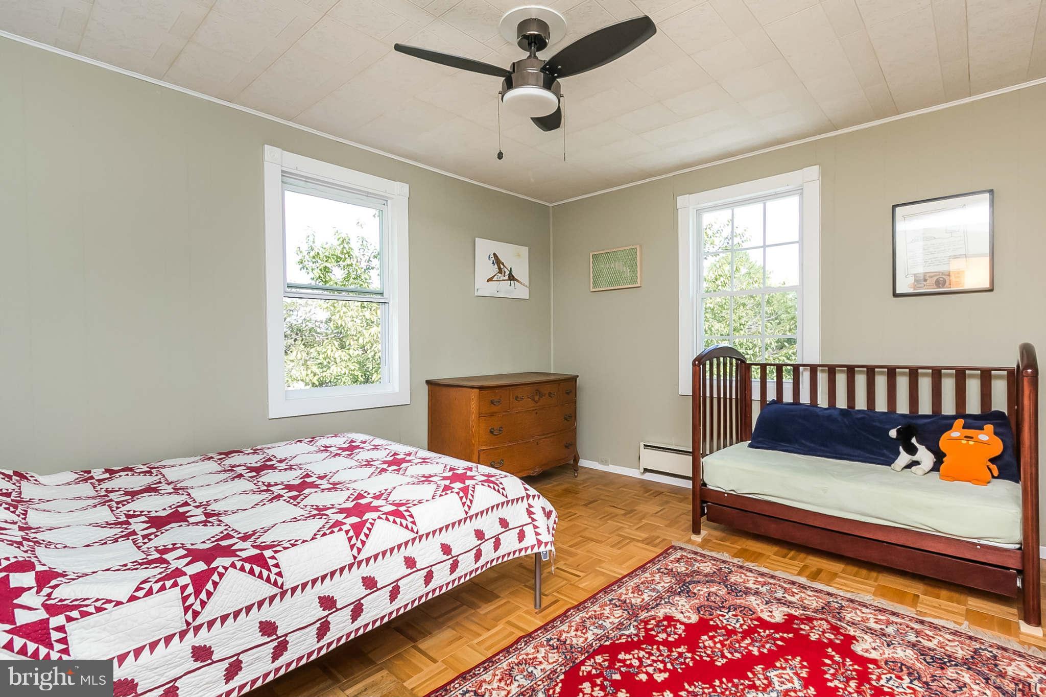 5506 Tramore Road Baltimore, MD 21214 - Photo 18 of 30 a bedroom with a bed and a window