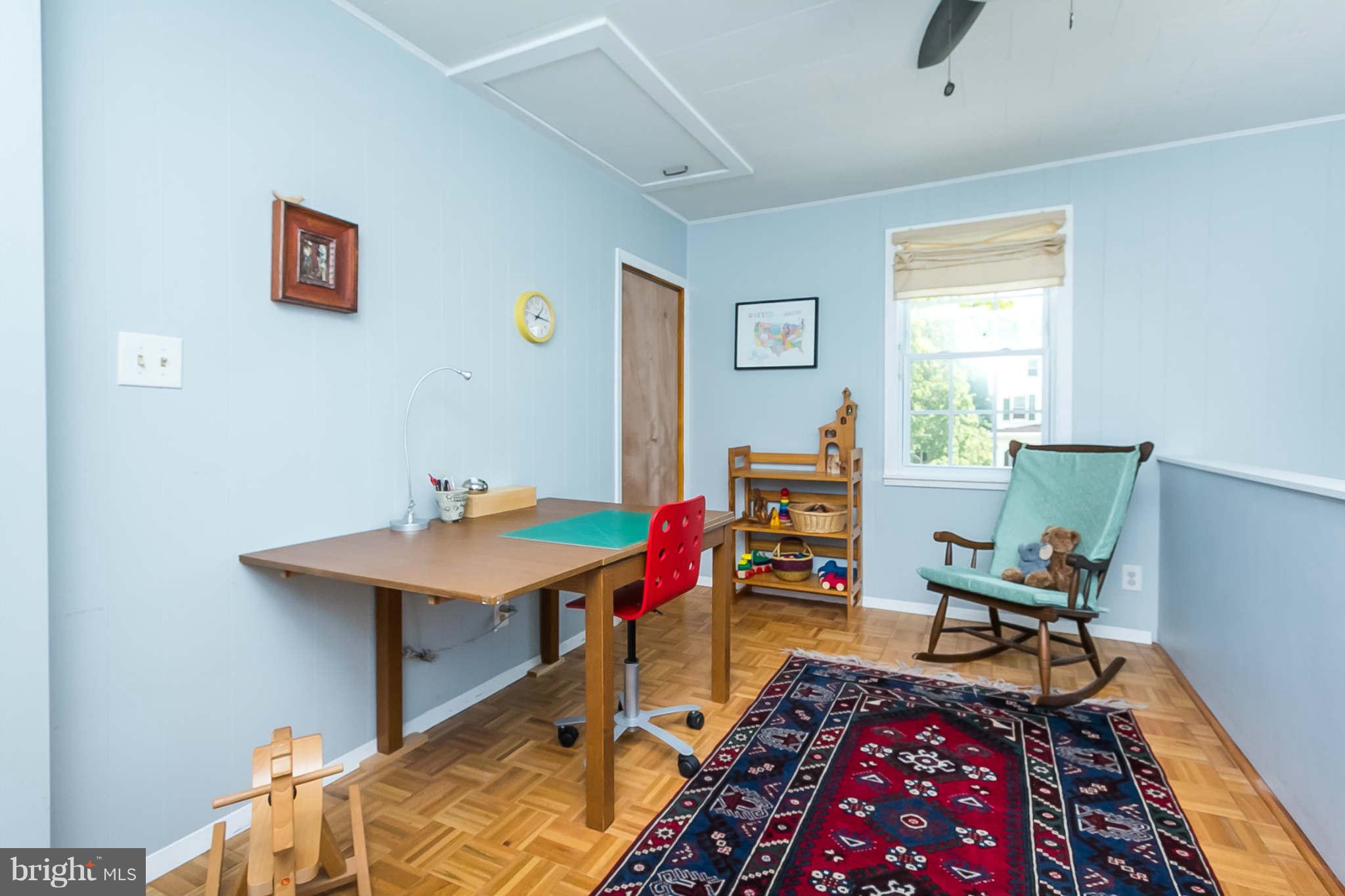 5506 Tramore Road Baltimore, MD 21214 - Photo 21 of 30 a living room with furniture and a rug