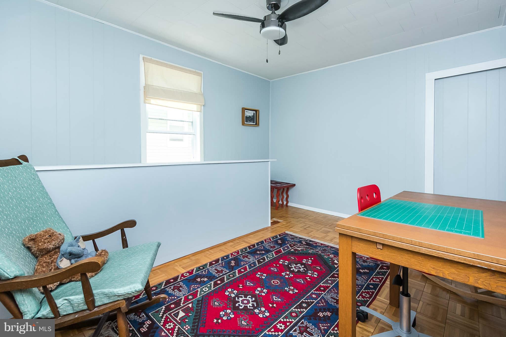 5506 Tramore Road Baltimore, MD 21214 - Photo 22 of 30 a bedroom with furniture and a window