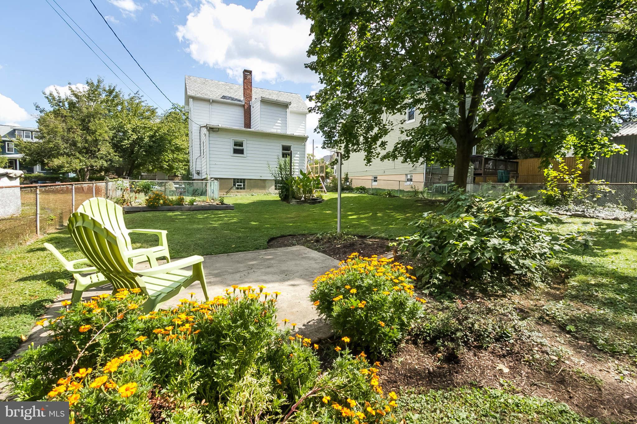 5506 Tramore Road Baltimore, MD 21214 - Photo 26 of 30 a view of a house with a yard and sitting area