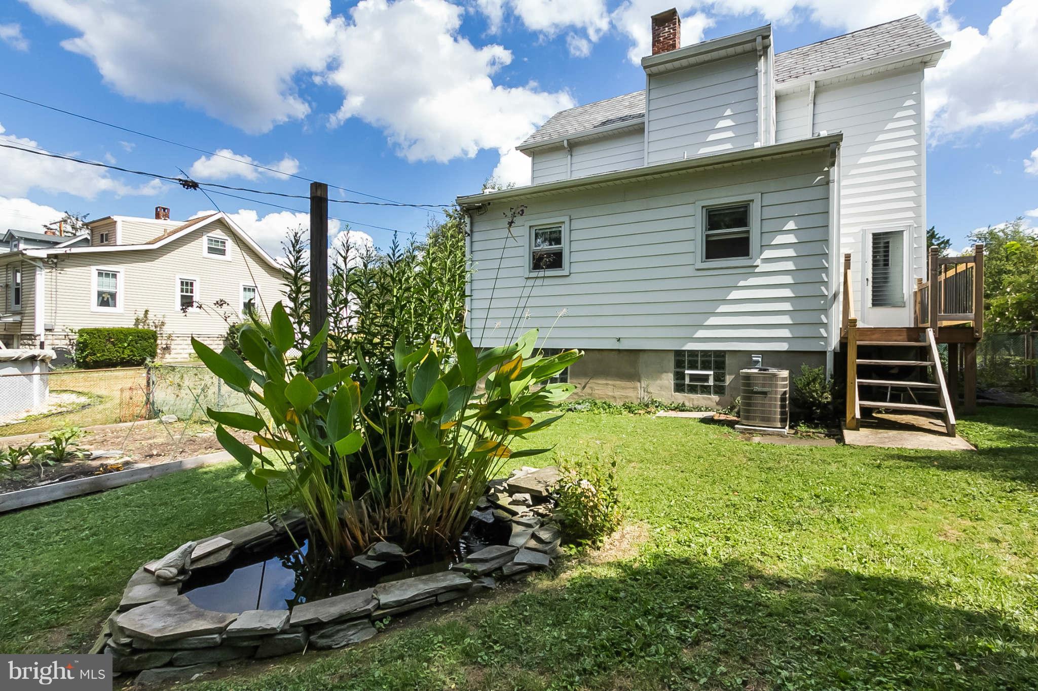 5506 Tramore Road Baltimore, MD 21214 - Photo 27 of 30 a view of a backyard with plants and a patio