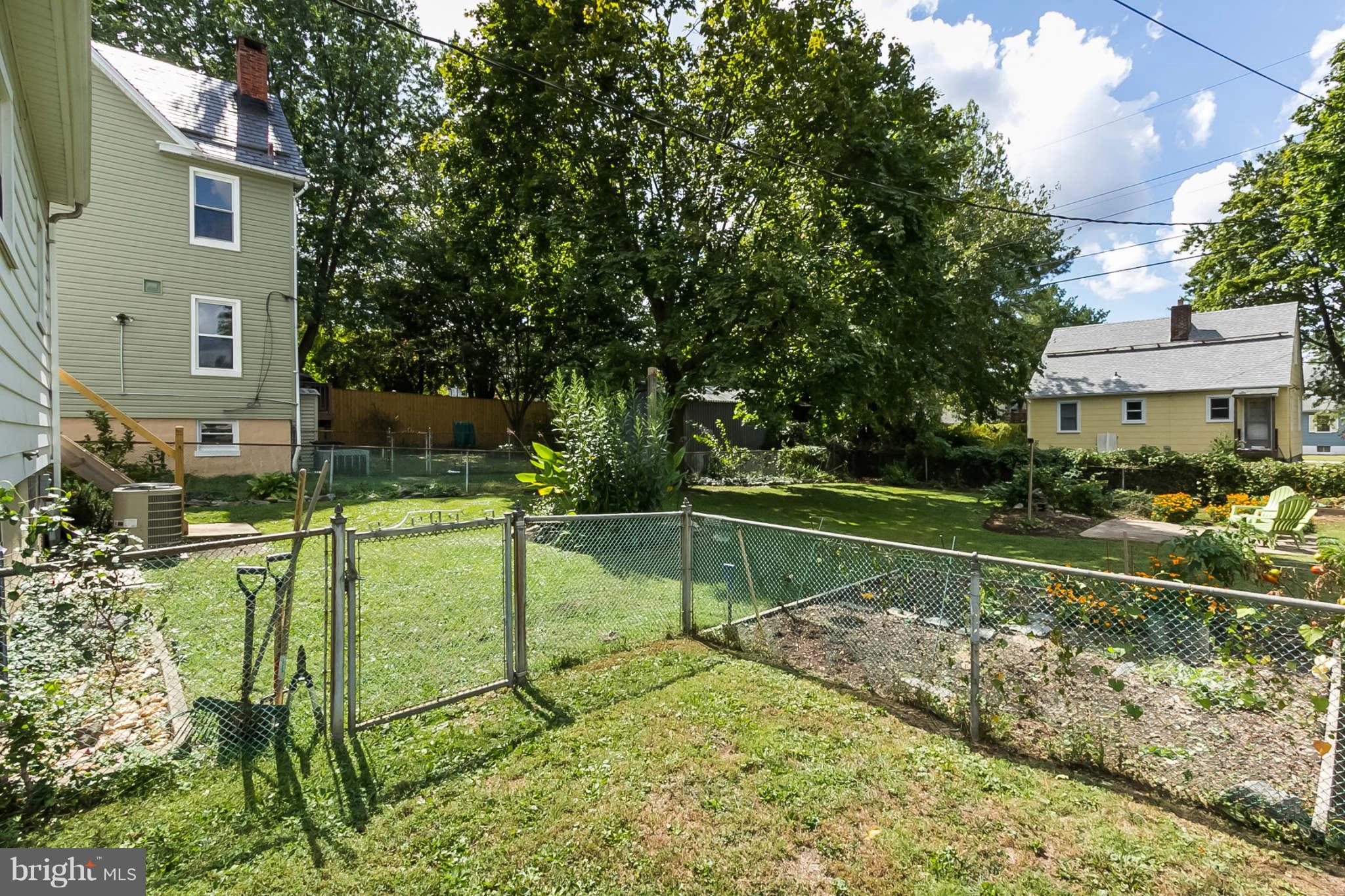 5506 Tramore Road Baltimore, MD 21214 - Photo 28 of 30 a view of a house with a yard