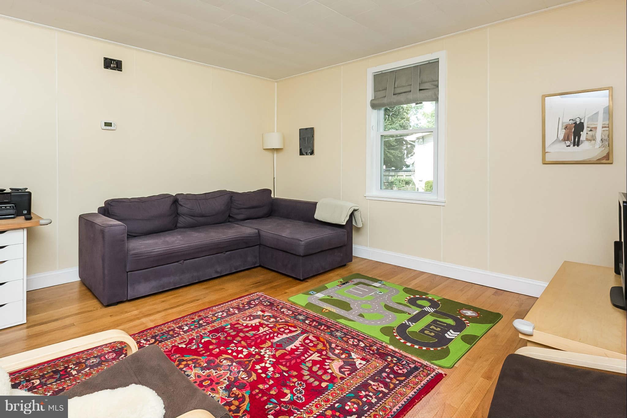 5506 Tramore Road Baltimore, MD 21214 - Photo 5 of 30 a living room with furniture and a rug