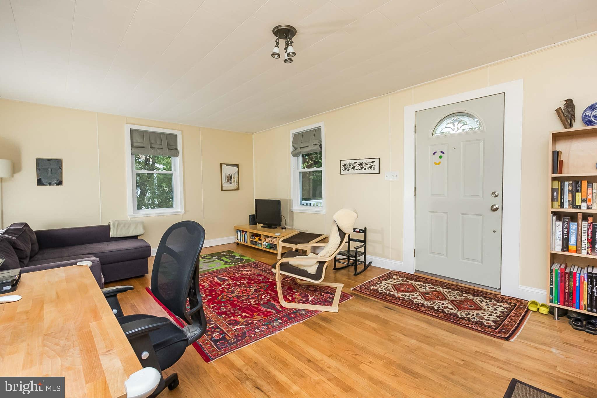 5506 Tramore Road Baltimore, MD 21214 - Photo 7 of 30 a living room with furniture and a window