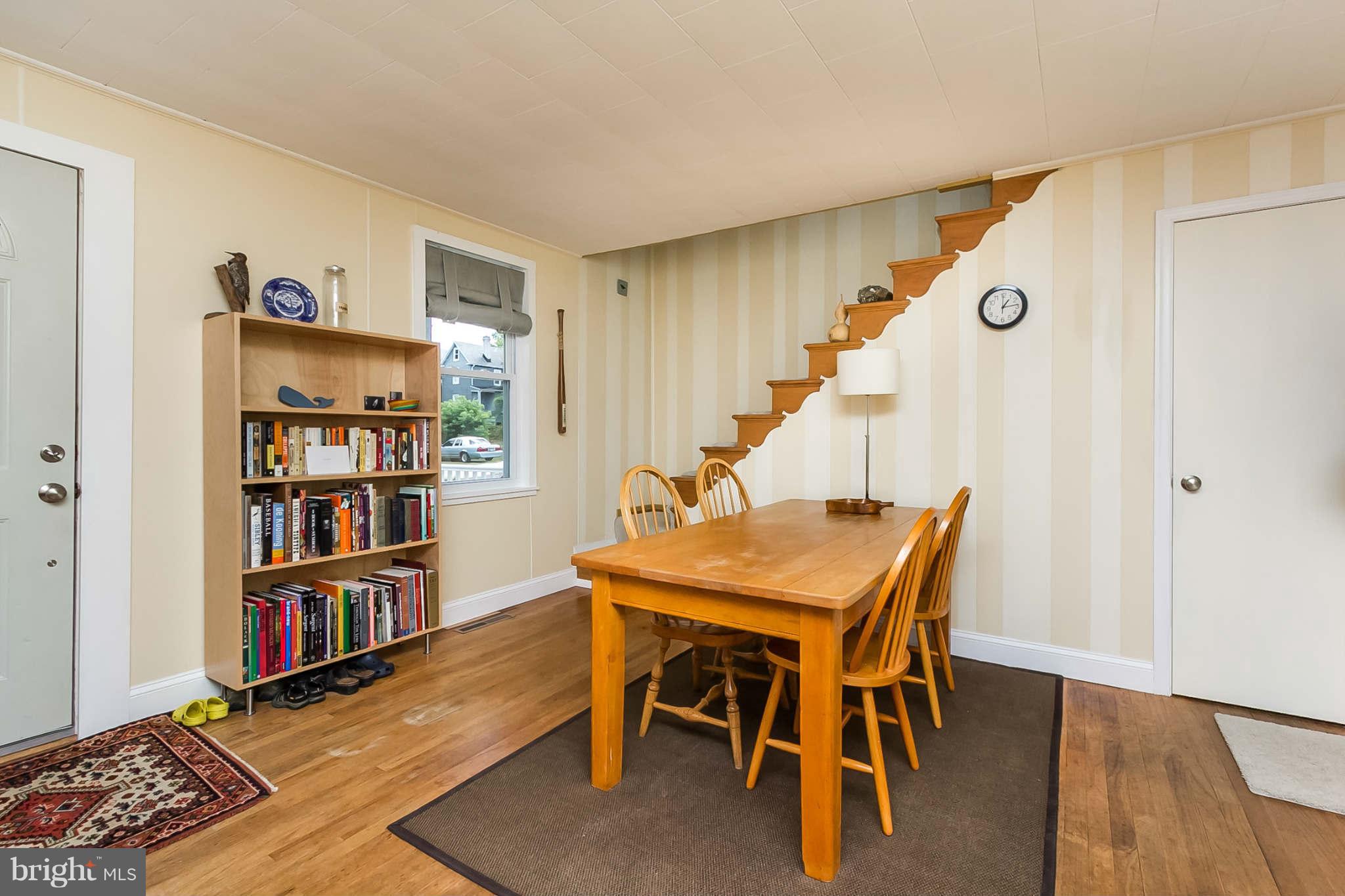 5506 Tramore Road Baltimore, MD 21214 - Photo 8 of 30 a dining room with furniture and wooden floor