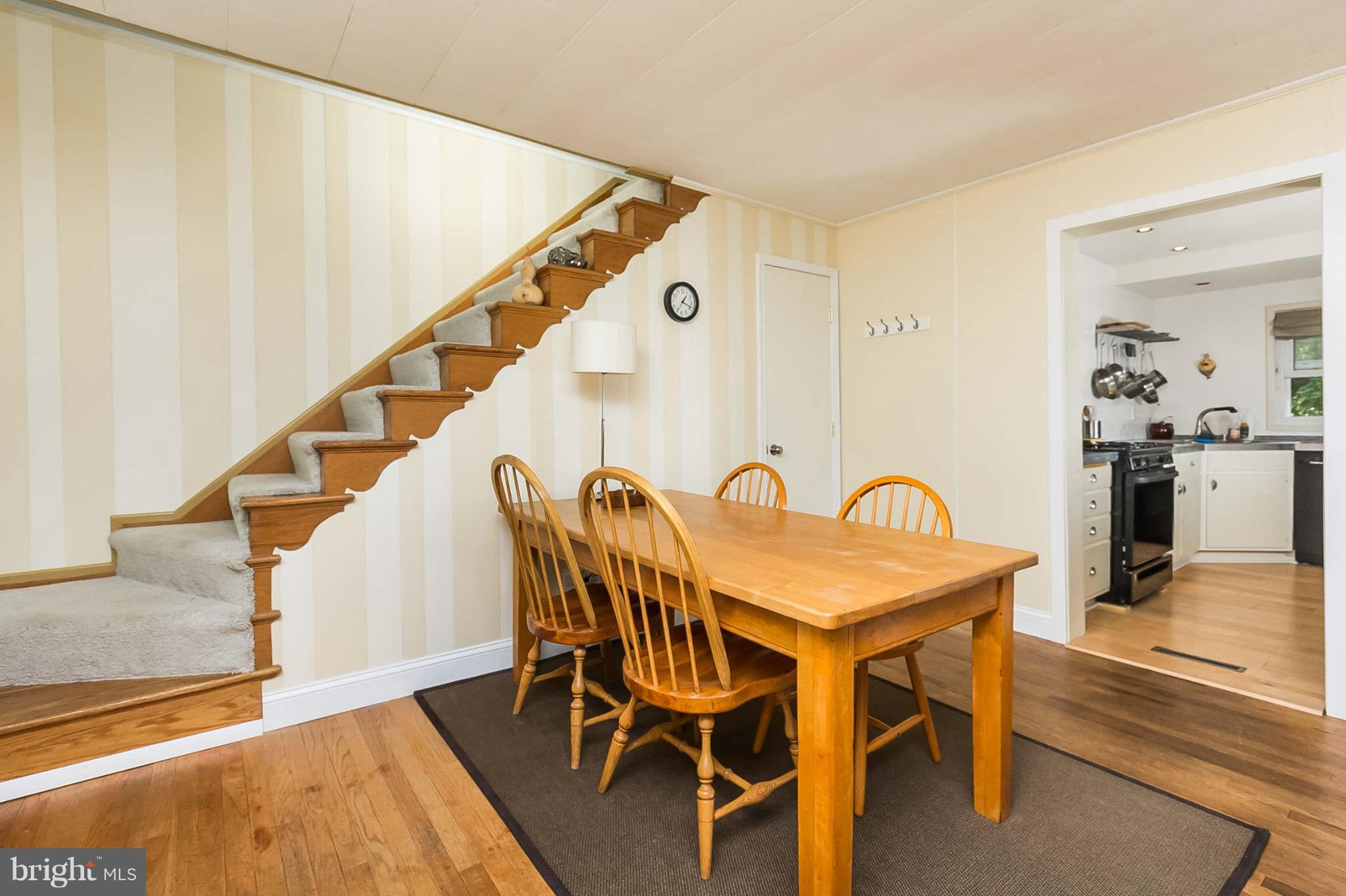 5506 Tramore Road Baltimore, MD 21214 - Photo 10 of 30 a dining room with furniture and entryway