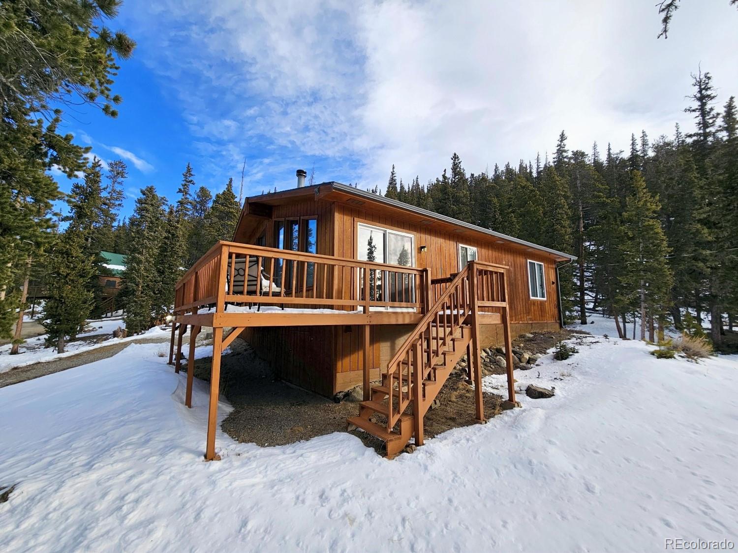 394 Co Road Fairplay, CO 80440 - Photo 13 of 46 a view of a roof deck with chair and wooden floor