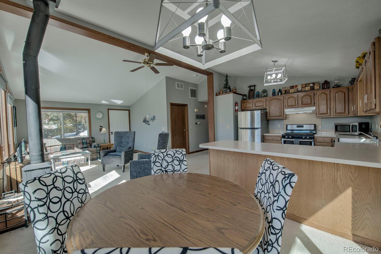 394 Co Road Fairplay, CO 80440 - Photo 19 of 46 a living room with furniture and a chandelier