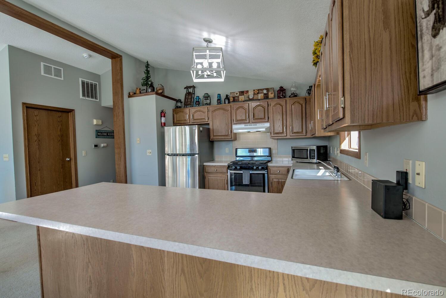 394 Co Road Fairplay, CO 80440 - Photo 20 of 46 a kitchen with refrigerator and window