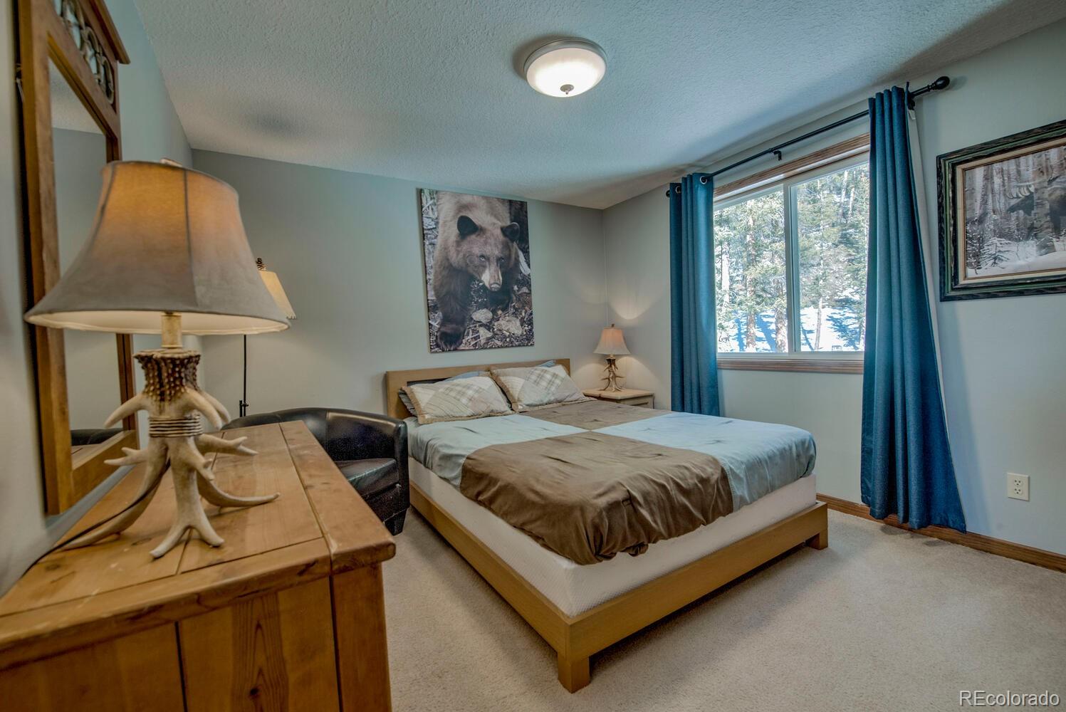 394 Co Road Fairplay, CO 80440 - Photo 27 of 46 a bedroom with a bed and a table in it