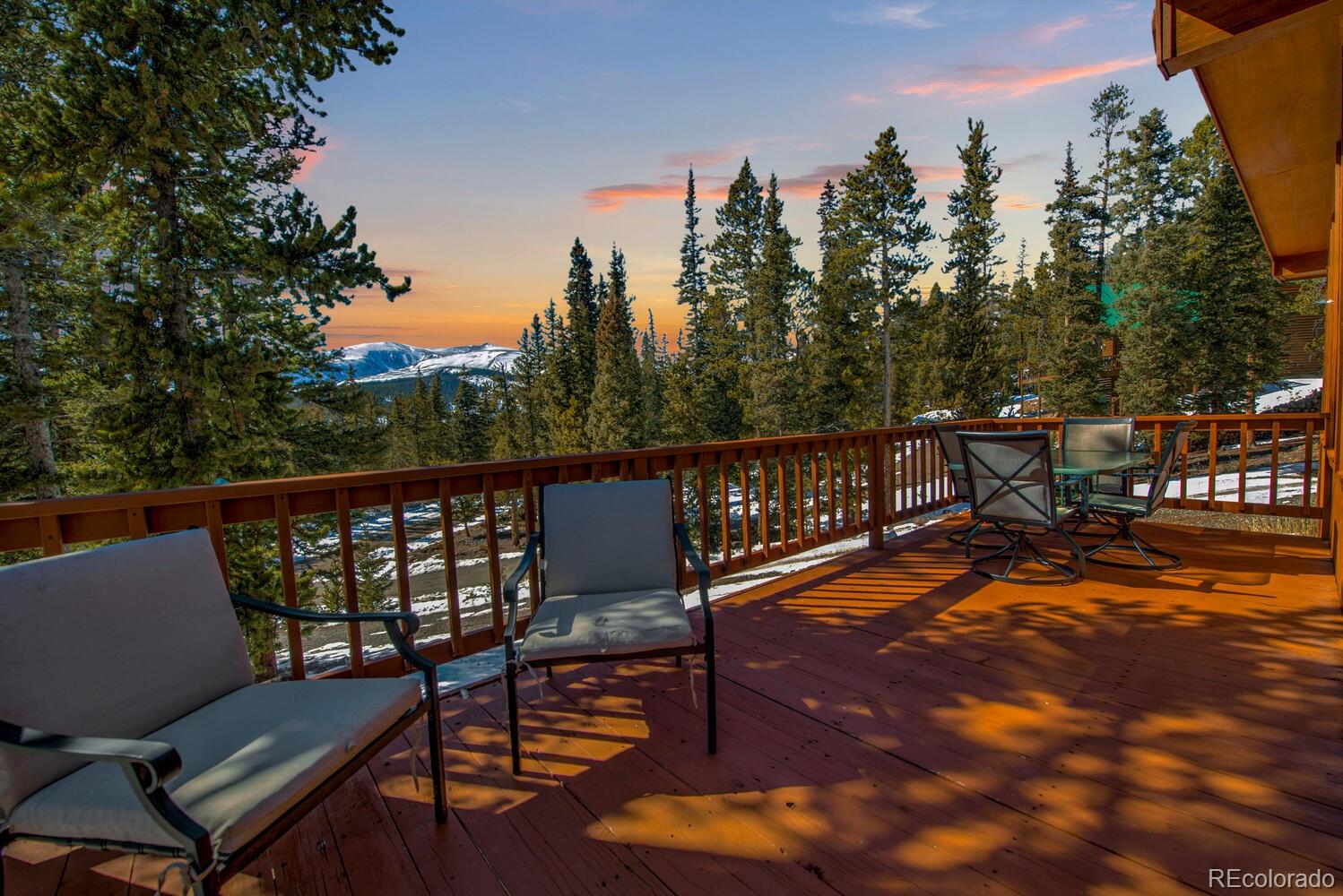 394 Co Road Fairplay, CO 80440 - Photo 10 of 46 a balcony with wooden floor table and chairs