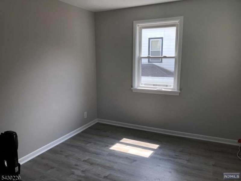 166 Carmita Avenue Rutherford, NJ 07070 - Photo 8 of 27 an empty room with a window
