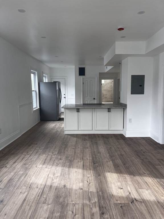 19 Reeves Street Worcester, MA 01607 - Photo 10 of 30 a view of a kitchen with wooden floor and cabinets