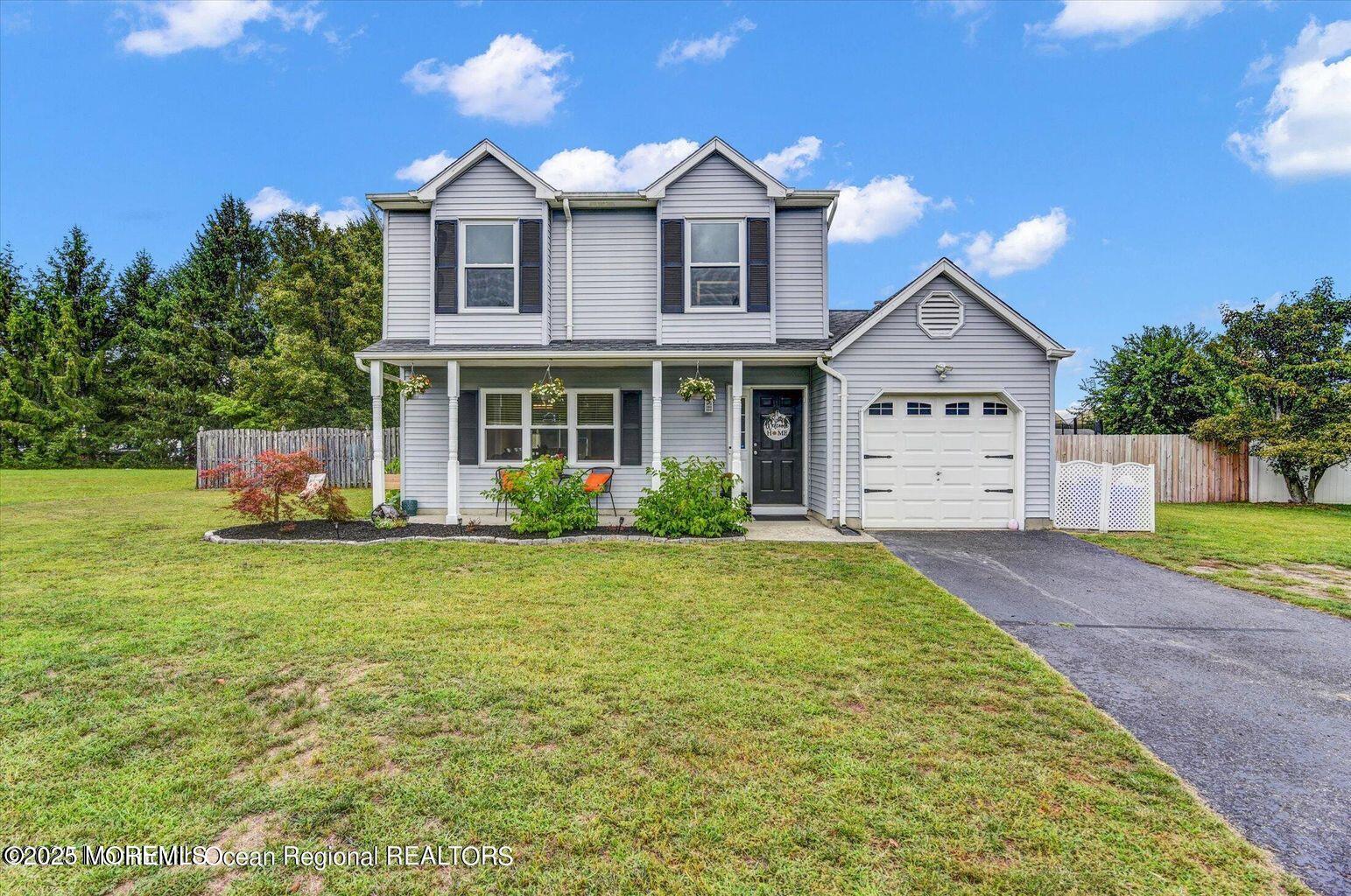 3 Albatross Drive Howell, NJ 07731 - Photo 1 of 16 a front view of a house with a yard and garage