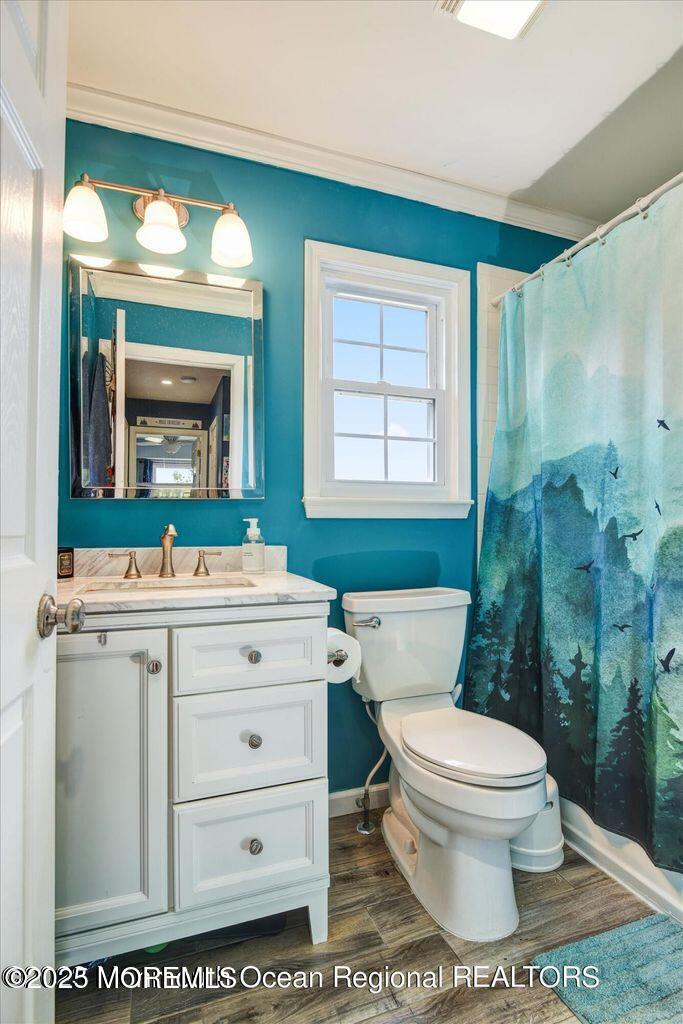 3 Albatross Drive Howell, NJ 07731 - Photo 11 of 16 a bathroom with a toilet a sink and mirror
