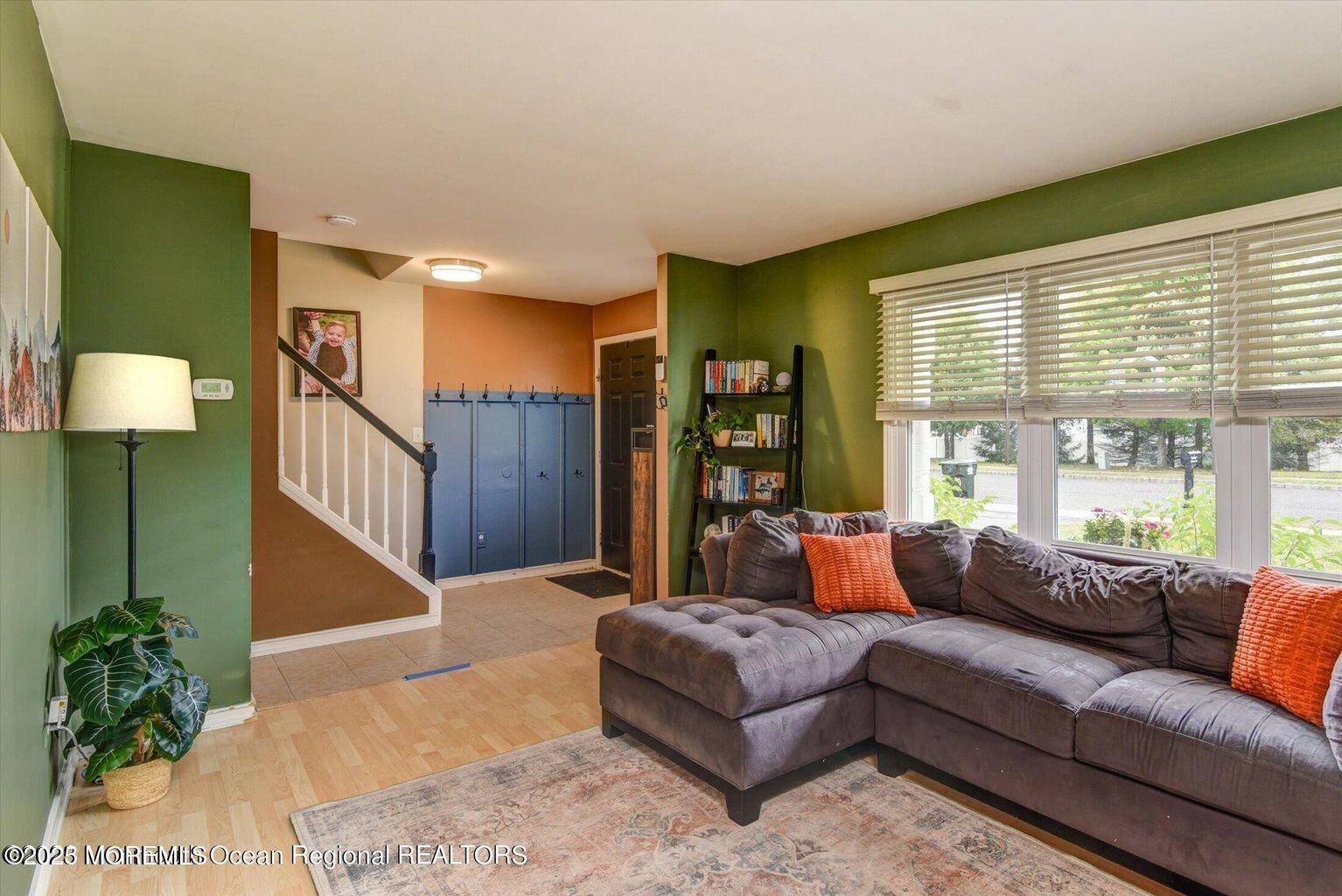 3 Albatross Drive Howell, NJ 07731 - Photo 3 of 16 a living room with furniture and a large window