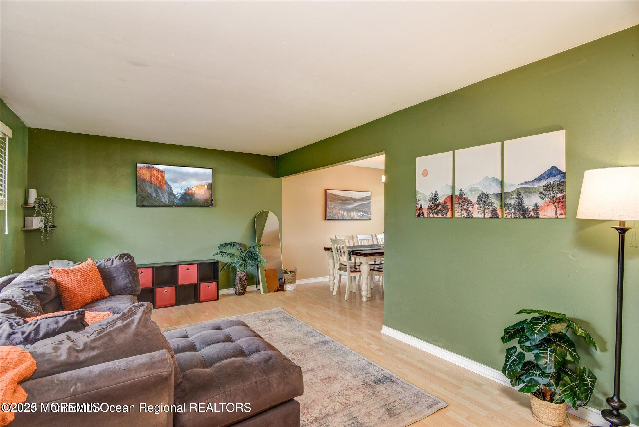 3 Albatross Drive Howell, NJ 07731 - Photo 4 of 16 a living room with furniture and a potted plant