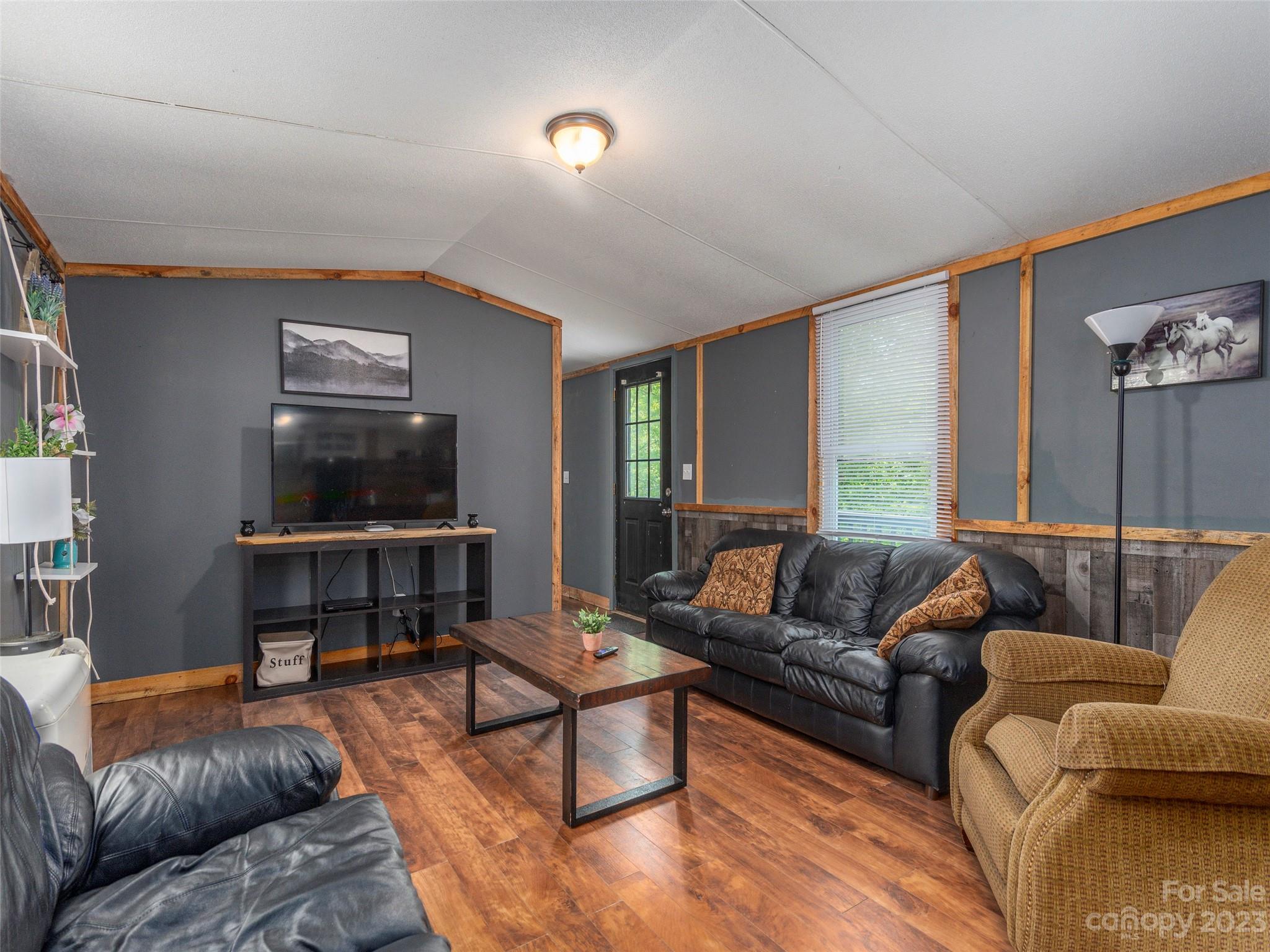 18 Autumn Mist Drive Fairview, NC 28730 - Photo 1 of 22 a living room with furniture and a flat screen tv