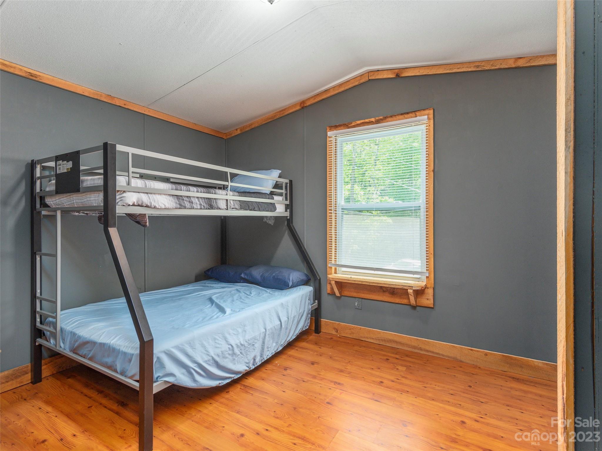 18 Autumn Mist Drive Fairview, NC 28730 - Photo 12 of 22 a bedroom with a bed and a window