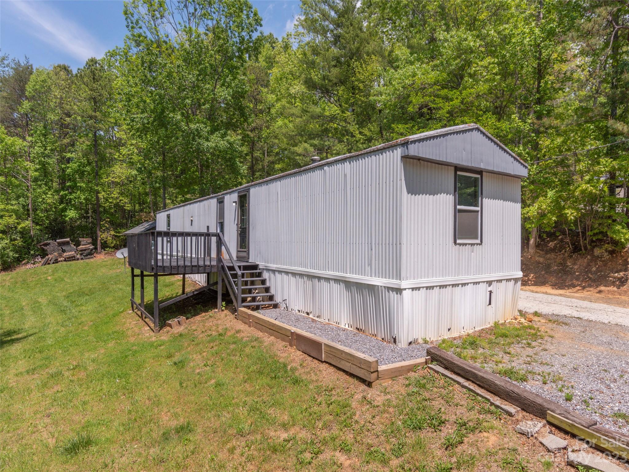 18 Autumn Mist Drive Fairview, NC 28730 - Photo 19 of 22 a view of backyard with small cabin and wooden fence