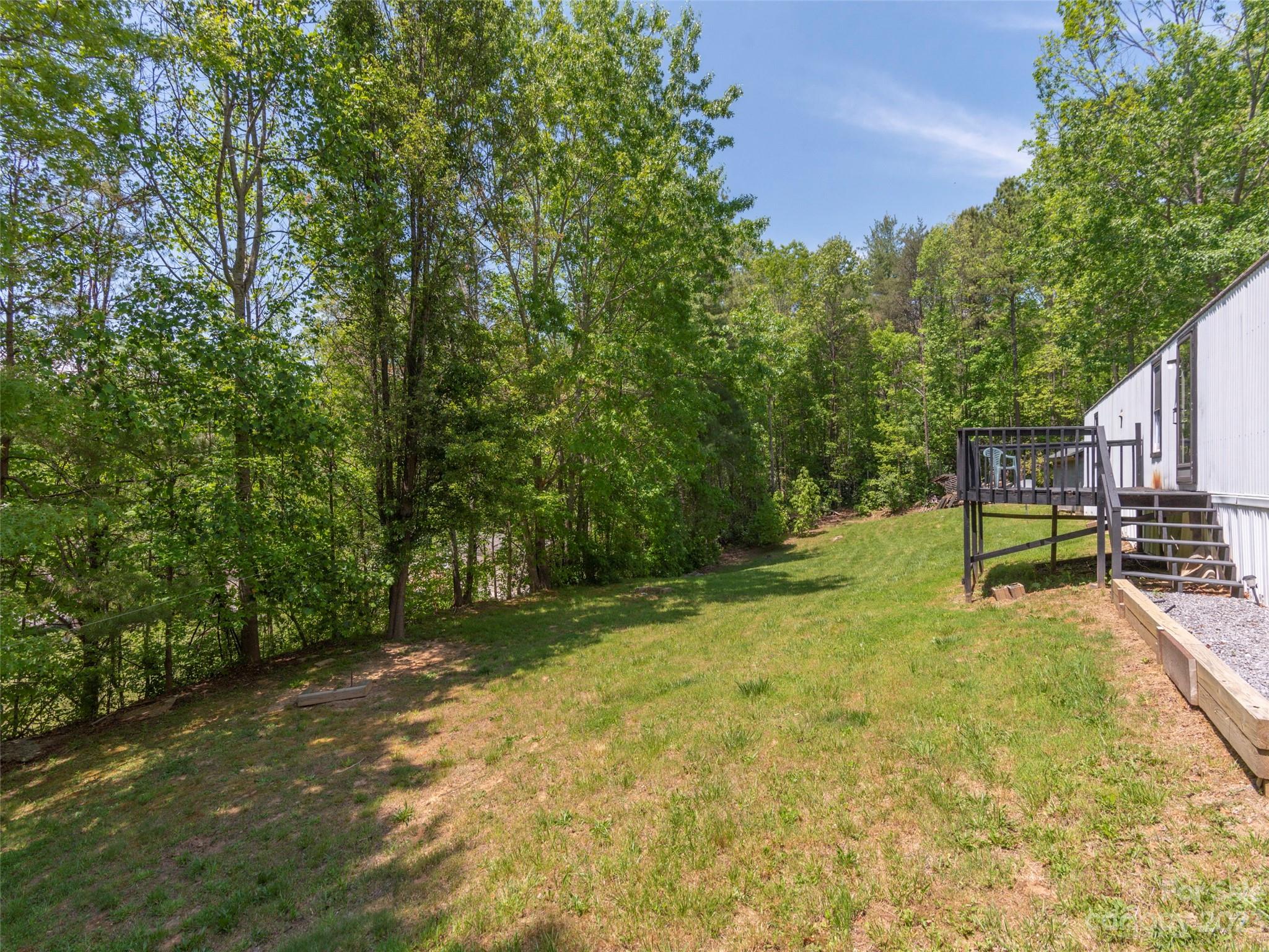 18 Autumn Mist Drive Fairview, NC 28730 - Photo 20 of 22 a swimming pool with outdoor seating and yard