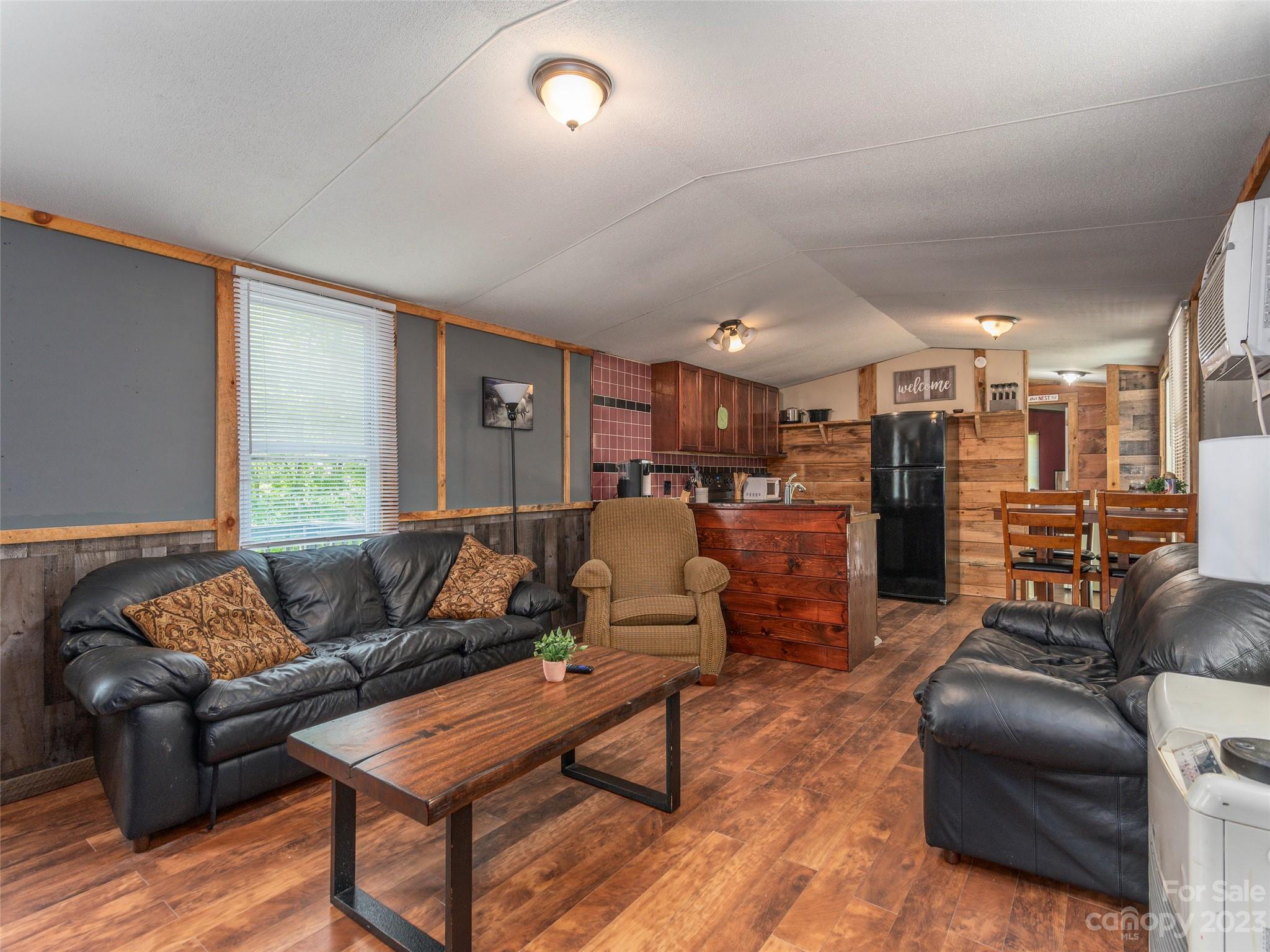 18 Autumn Mist Drive Fairview, NC 28730 - Photo 2 of 22 a living room with furniture and kitchen view