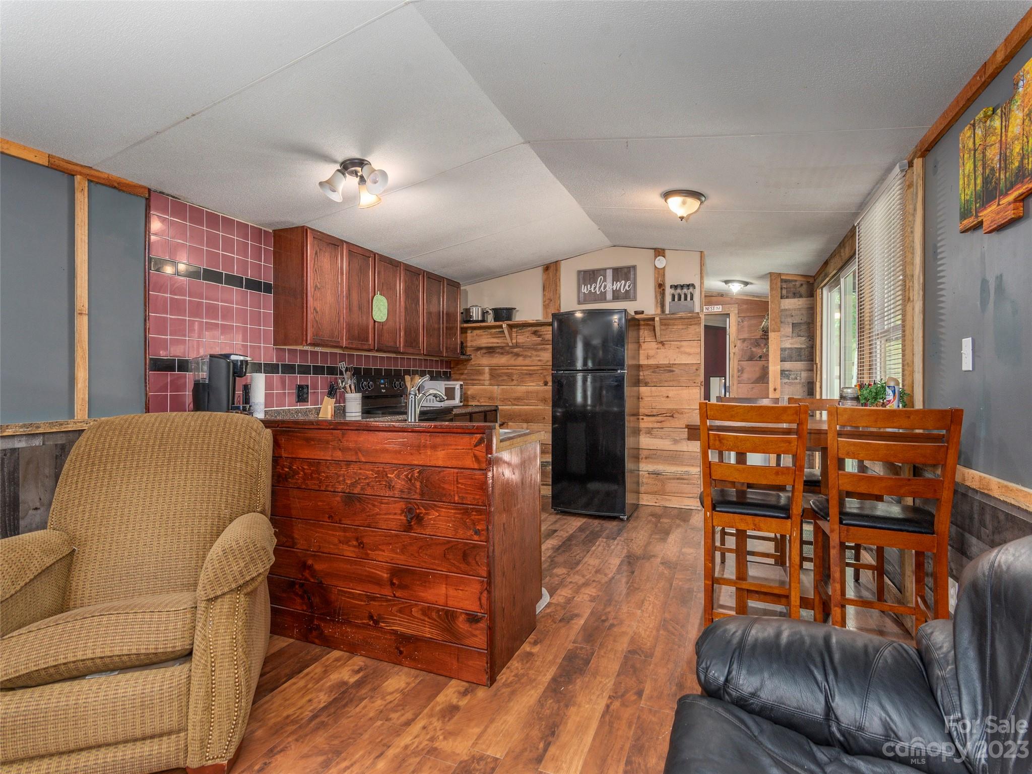 18 Autumn Mist Drive Fairview, NC 28730 - Photo 3 of 22 a living room with furniture and a kitchen view