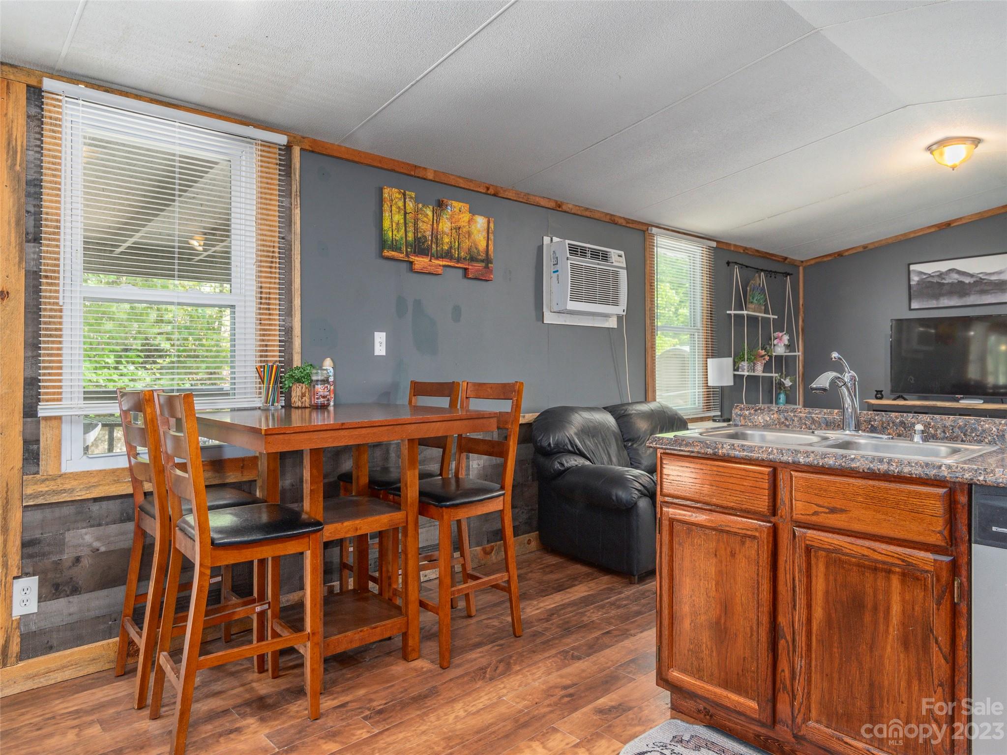 18 Autumn Mist Drive Fairview, NC 28730 - Photo 5 of 22 a dining room with furniture window and wooden floor