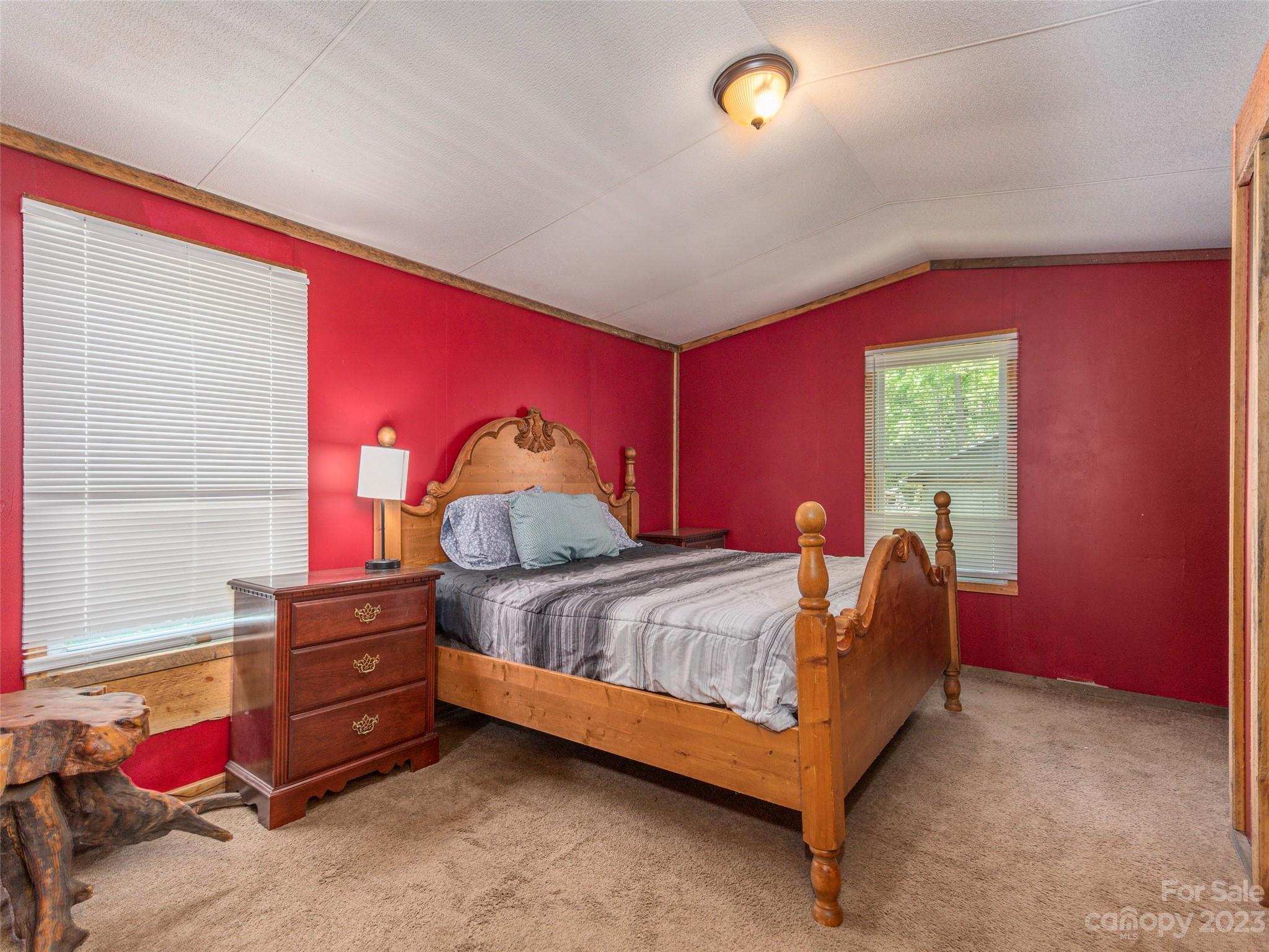 18 Autumn Mist Drive Fairview, NC 28730 - Photo 6 of 22 a bed sitting in a room next to a window