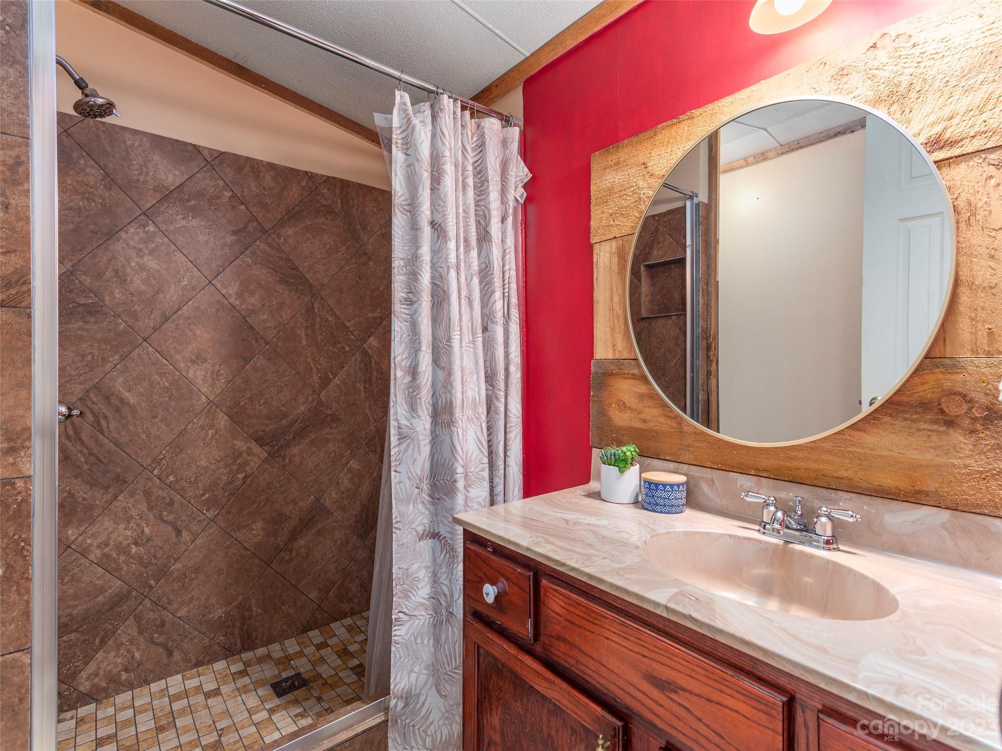 18 Autumn Mist Drive Fairview, NC 28730 - Photo 8 of 22 a bathroom with a sink and a mirror