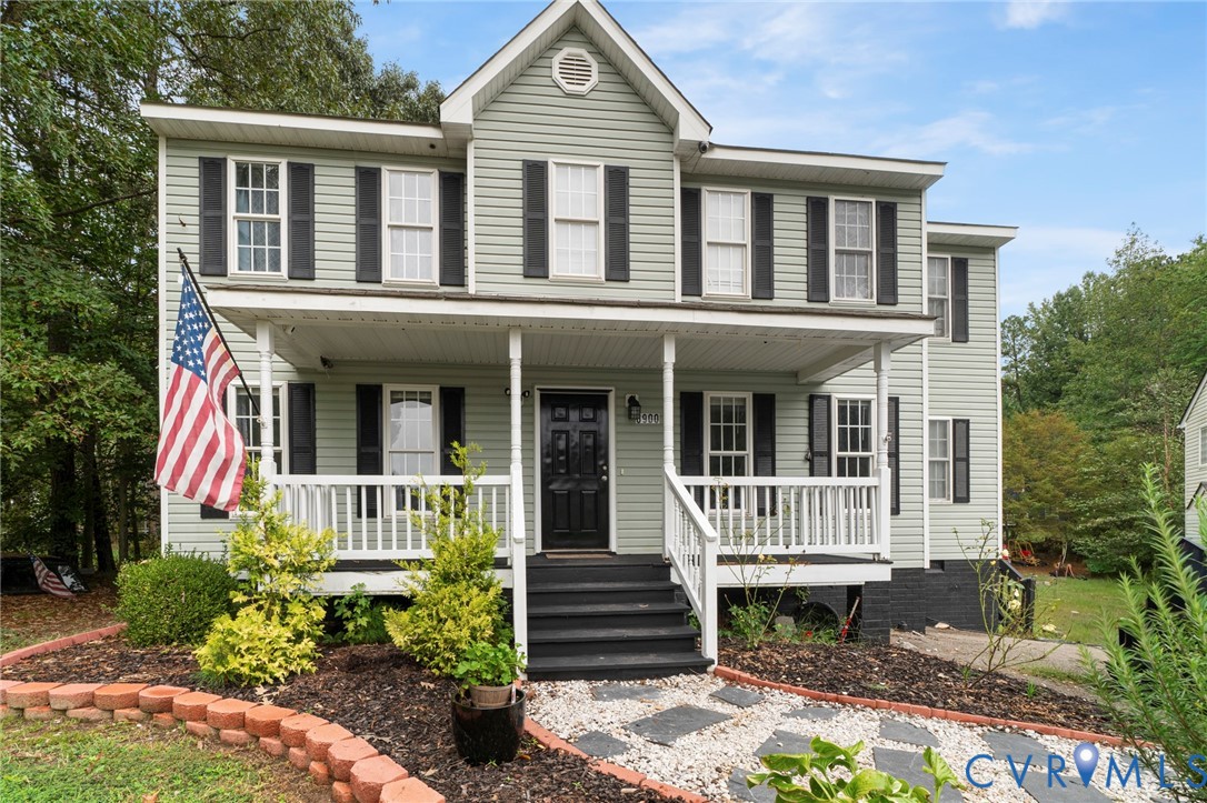 front view of a house with a yard