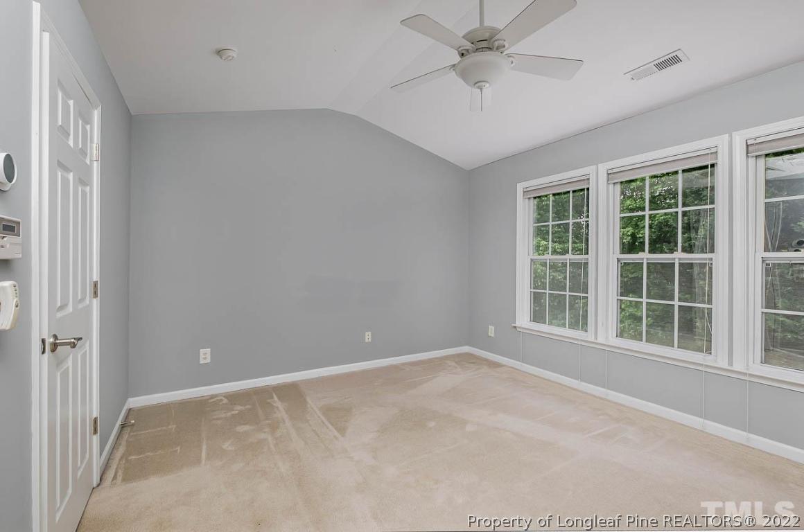 5441 Golden Arrow Lane Raleigh, NC 27613 - Photo 18 of 26 an empty room with windows and entrance